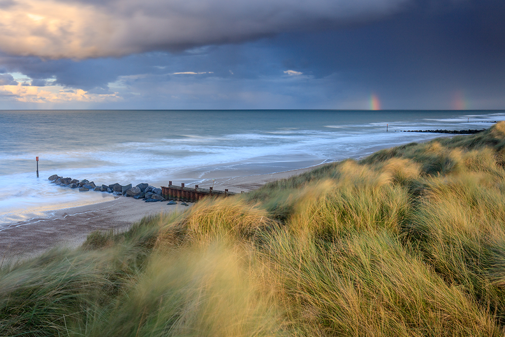 Waxham Dunes on the Norfolk Coast with rainbow