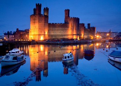 Caernarfon Castle photographed at dusk in North Wales