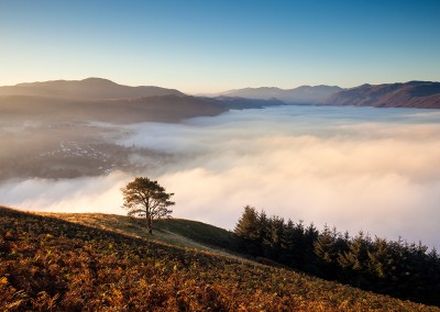 Landscape image of a misty valley in the Lake District