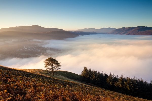 Landscape image of a misty valley in the Lake District