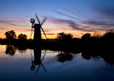 Turf Fen Drainage Mill reflecting in the River Ant at sunset on the Norfolk Broads