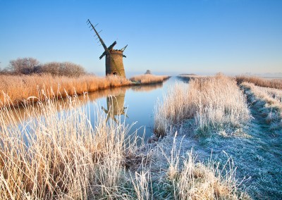 The derelict mill of Brograve on the Norfolk Broads following an overnight winter hoarfrost