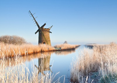 The derelict mill of Brograve on the Norfolk Broads following an overnight winter hoarfrost