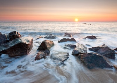 Happisburgh beach and the derelict sea defences captured at sunrise on the Nofolk Coast