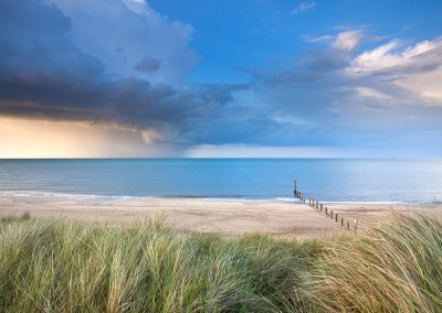 Sand Dunes at Horsey with a dramatic summer storm out at sea