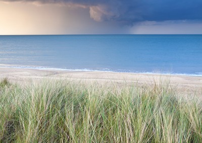 Sand Dunes at Horsey with a dramatic summer storm out at sea