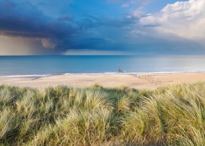 Sand Dunes at Horsey with a dramatic summer storm out at sea