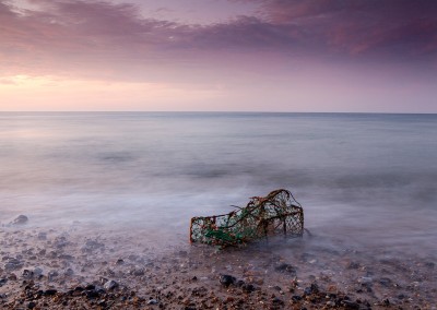 A washed up lobster pot on the beach at Cromer Pier on the North Norfolk Coast