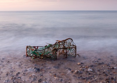 A washed up lobster pot on the beach at Cromer Pier on the North Norfolk Coast