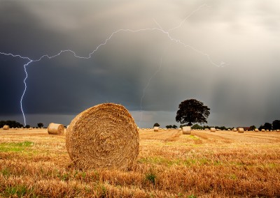 Thunder storm over a Straw Bale field in the Norfolk Countryside