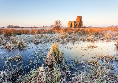 St Benet's Abbey on a frosty morning on the Norfolk Broads. The frozen water in the foreground is from the medieval fish ponds that would have kept the monks well fed.