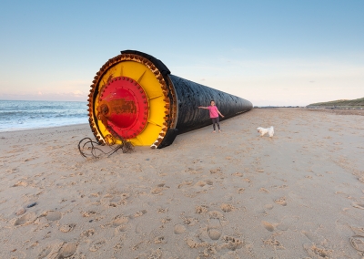 One of many giant pipes washed up onto the Norfolk Coast at Winterton & Horsey. This one was over half a mile long and shows my daughter and dog for scale.