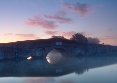 Potter Heigham bridge on a misty summers morning on the Norfolk Broads