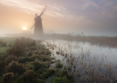 Mutton's Mill on a misty morning on the Norfolk Broads at sunrise
