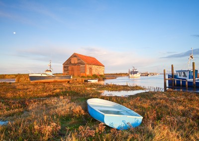 Thornham Harbour, Boats & the old coal shed at first light during a high tide on the North Norfolk Coast