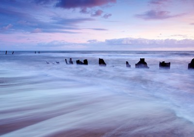 The remains of the now damaged sea defences at Happisburgh on the Norfolk Coast