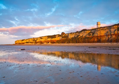 The layered cliffs and the lighthouse on at Old Hunstanton on the North Norfolk Coast.