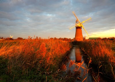 St Benets windpump with Thurne windpump in the distance photographed at last light on the Norfolk Broads