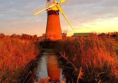 St Benets windpump with Thurne windpump in the distance photographed at last light on the Norfolk Broads