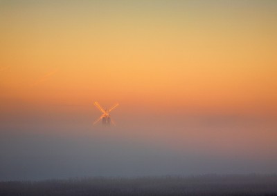 Berney Arms windmill on the Norfolk Broads rising from the Mist on a cold Decembers morning